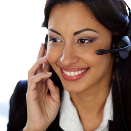 Smiling female customer support operator with headset